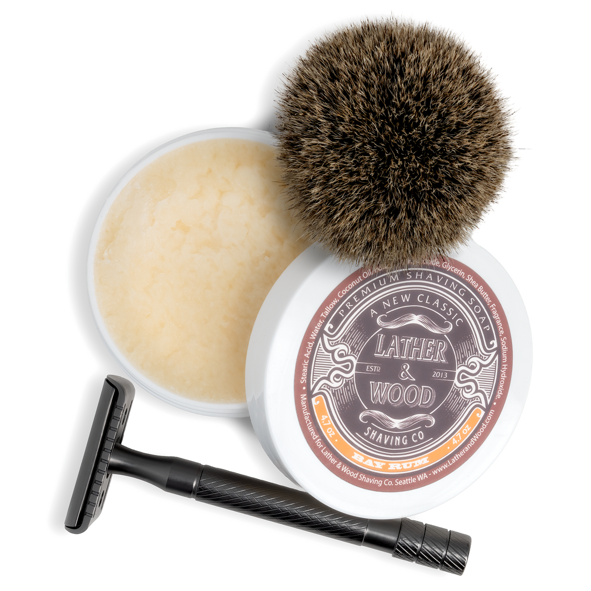 A complete wet shaving kit arranged on a white background